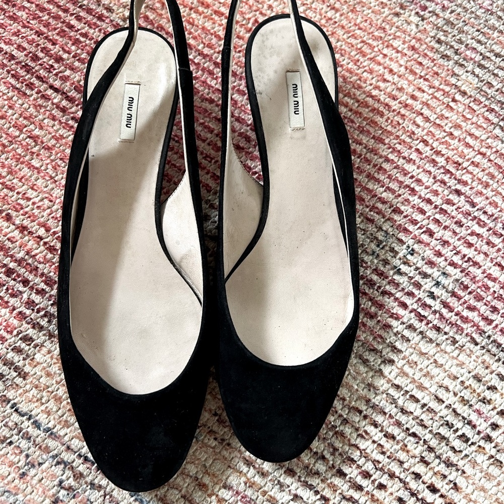 Miu Miu suede round toe pumps with kitten heels.